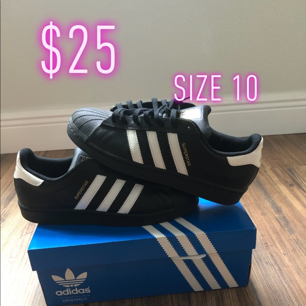 Black and white adidas superstars